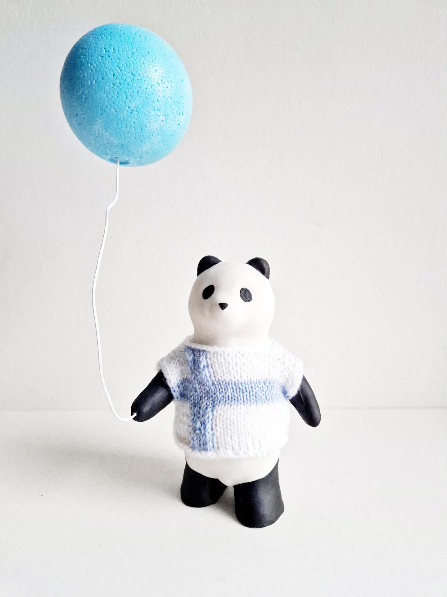 YASUSHI KOYAMA  Panda pelipaidassa, 2024   ceramics, wool, styrofoam 27 x 16 x 8 cm