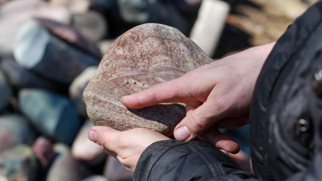 Johnny Juthman showing a stone he uses for art